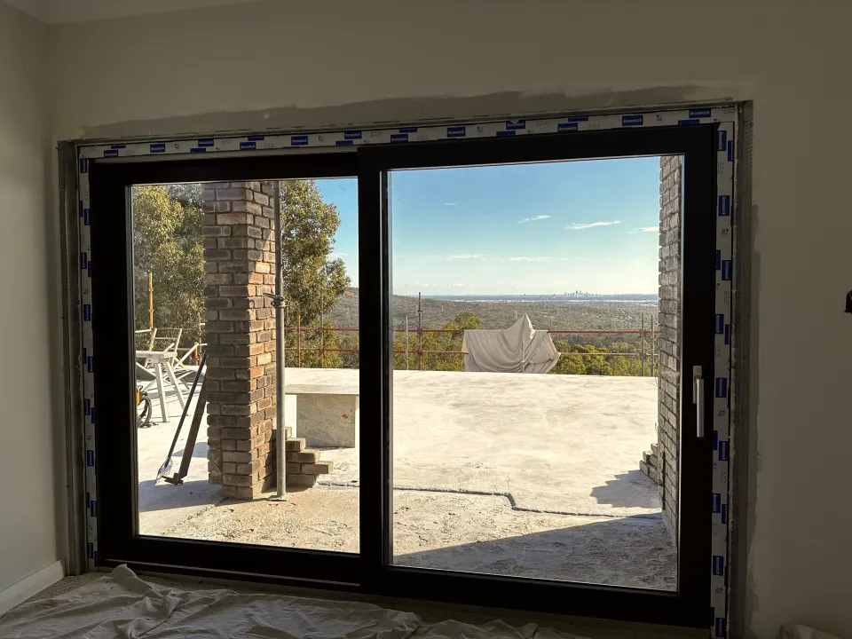 Anthracite lift-and-slide door in a new-build home