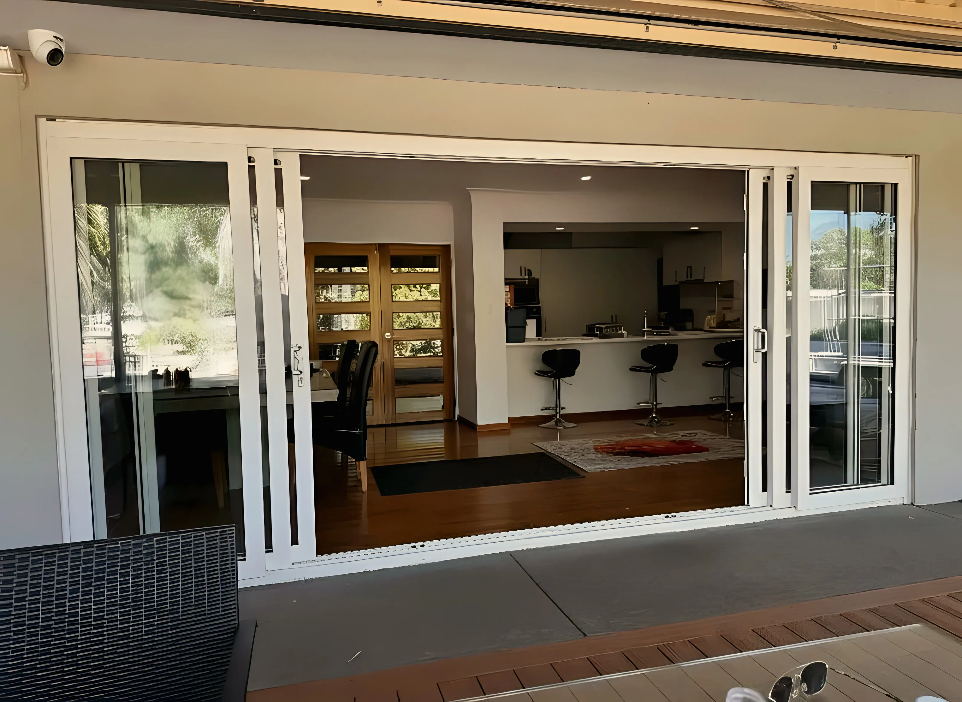 Multi-slide doors fully open from alfresco through to kitchen