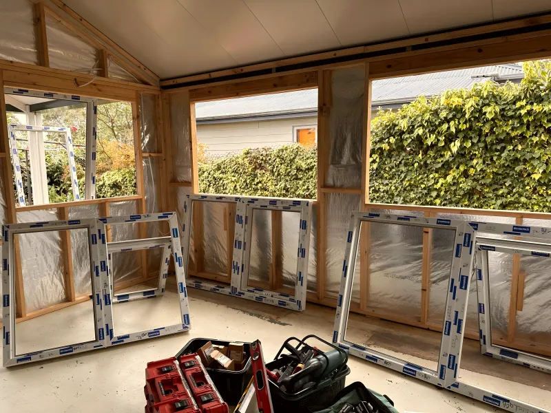 uPVC window frames delivered to site and stacked ready for installation