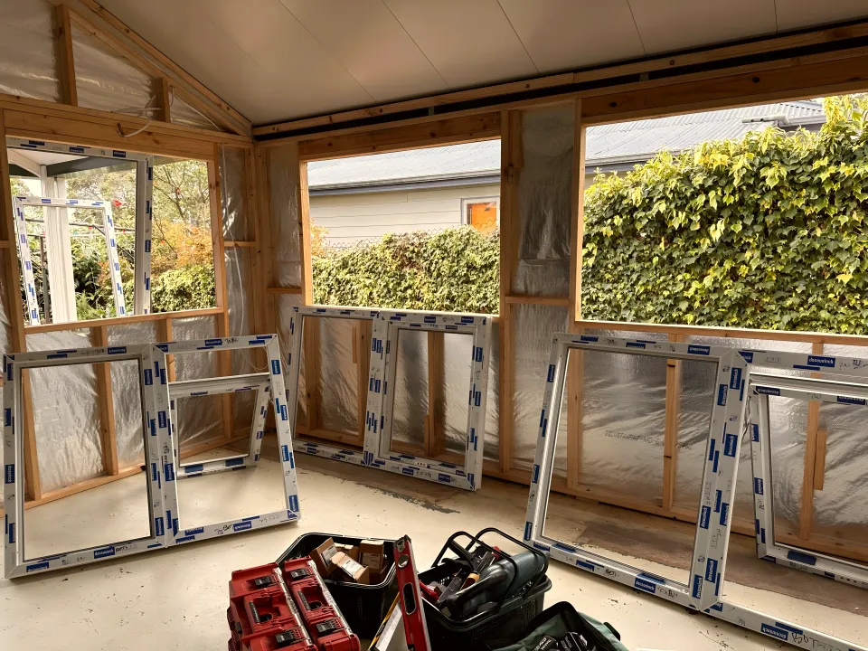 uPVC window frames delivered to site and stacked ready for installation