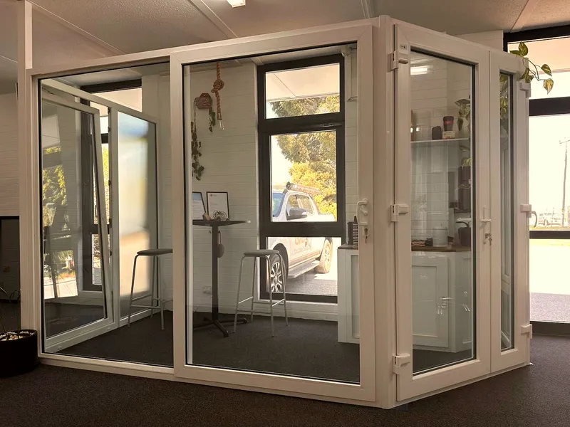 Seating area framed by double-glazed doors at the GaBe Kewdale showroom