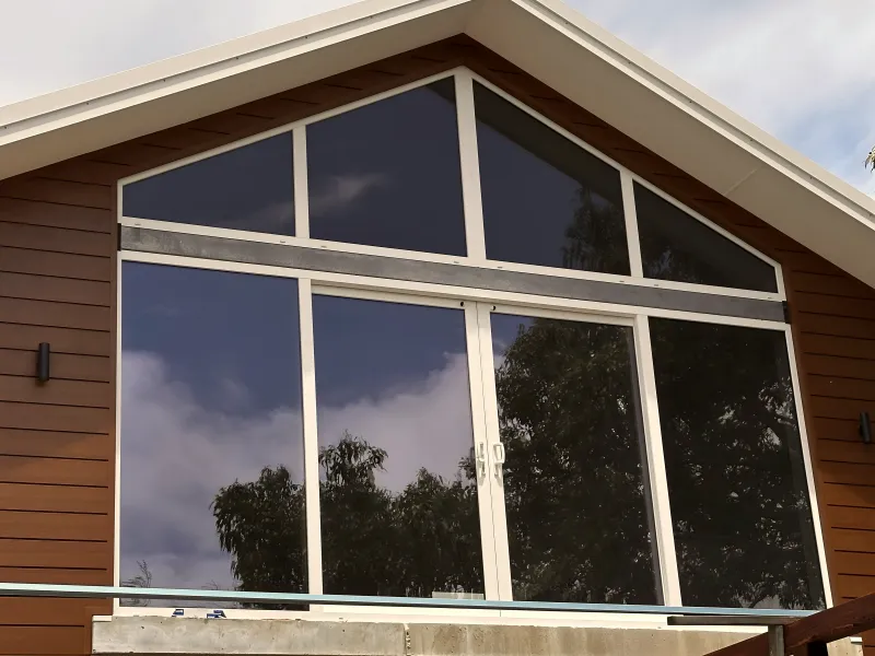 Raked gable window with fixed triangular glazing panels