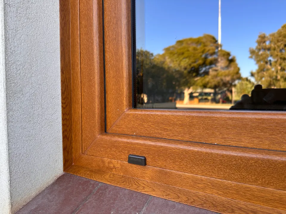 Close-up of woodgrain uPVC window frame finish