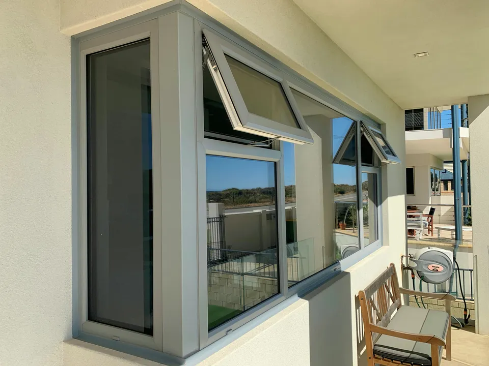 Open awning windows showing double-glazed sashes
