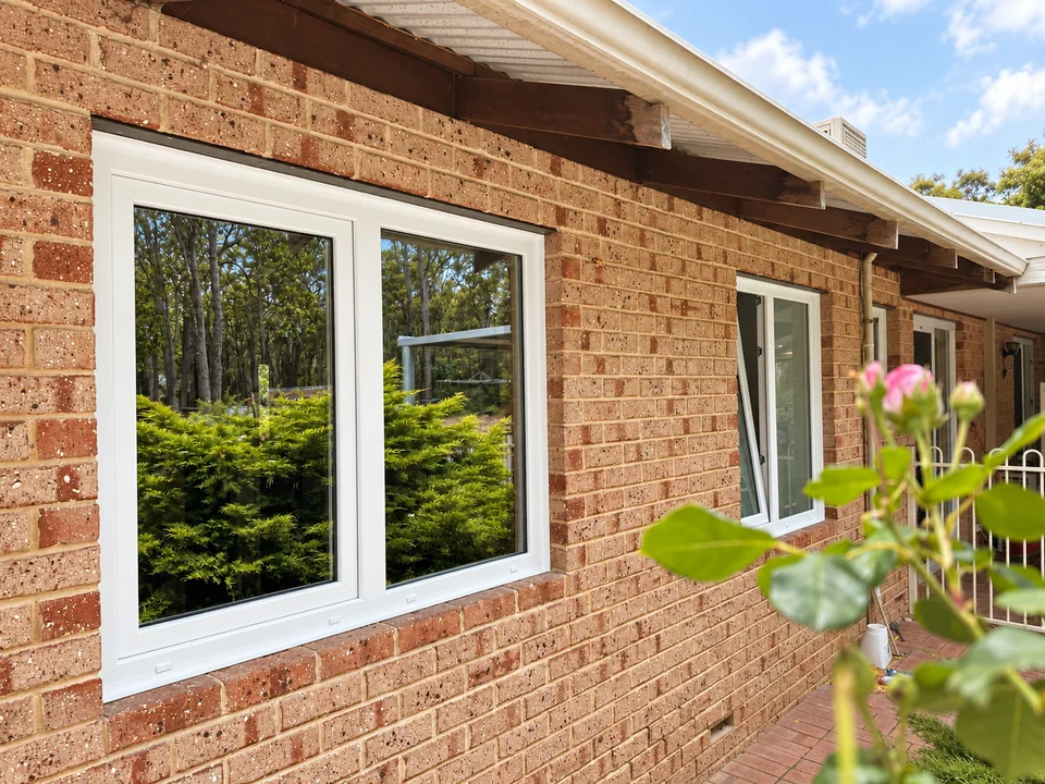 Fresh white uPVC retrofit windows installed into an existing brick Perth home