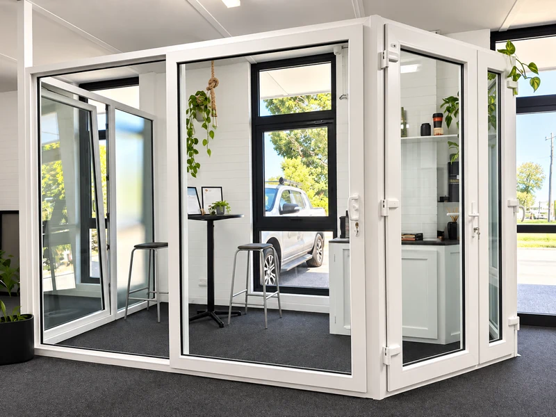 Seating area framed by double-glazed doors at the GaBe Kewdale showroom